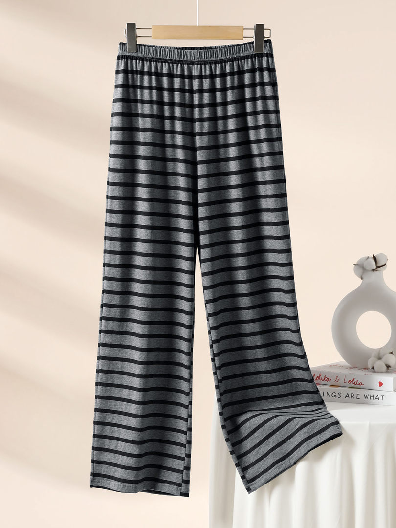 Gray and black striped wide-leg pants hanging on a hanger