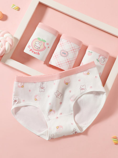 Pink and white cartoon-print women's underwear set laid flat