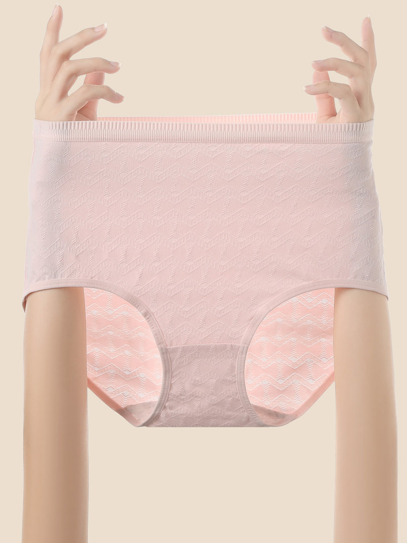 Pastel pink seamless underwear briefs held up by hands