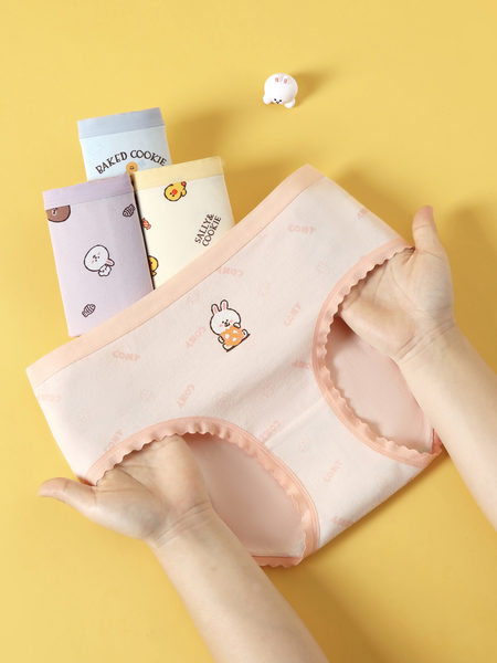 Pastel cartoon-print underwear briefs with a scalloped trim on a yellow background