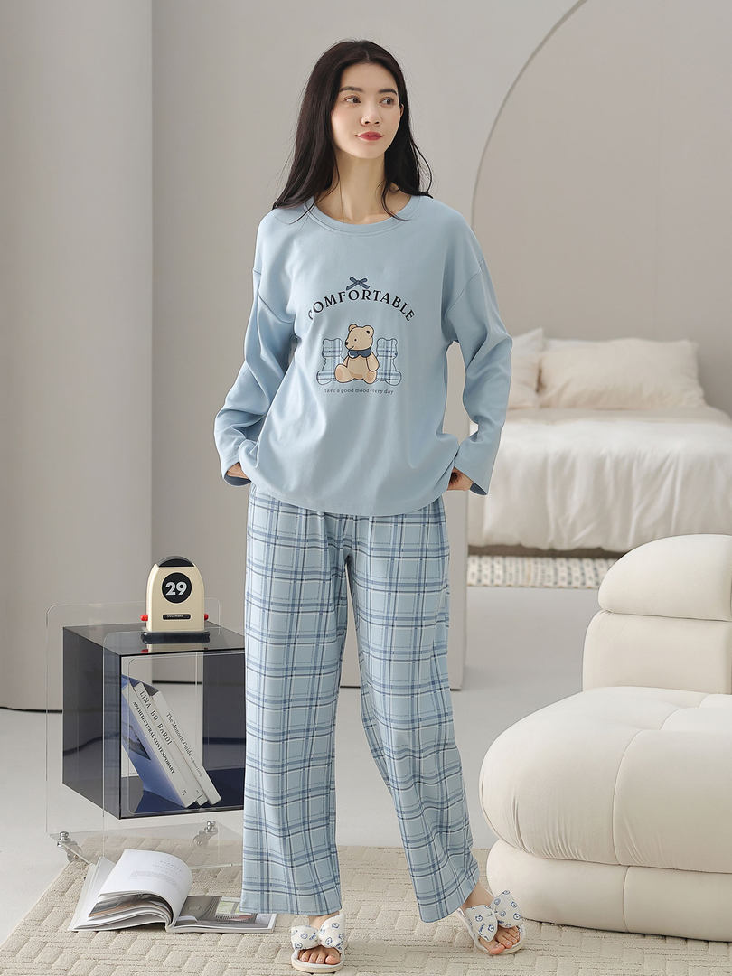 Model wearing light blue bear-print loungewear pajamas