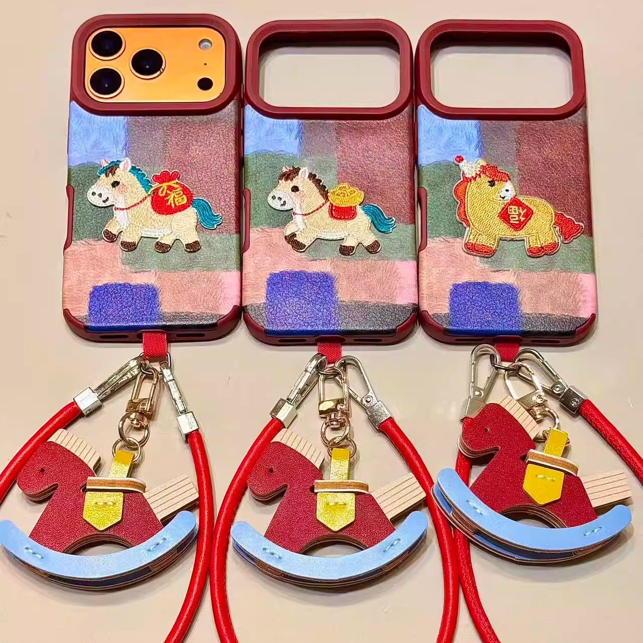 皮纹色块刺绣福袋發小马手拎绳适用苹果17promax手机壳iphone16新款15pro女款14pm全包保护壳