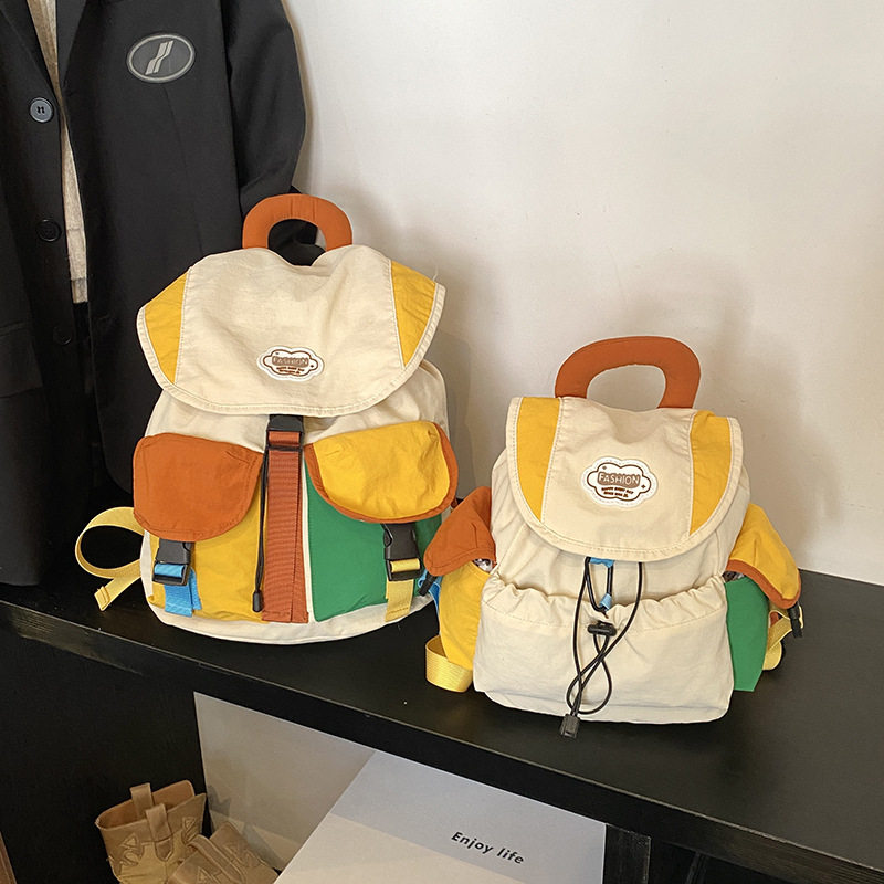 韩版多巴胺撞色女士双肩包网红洋气抽绳出游轻便学生书包新款背包