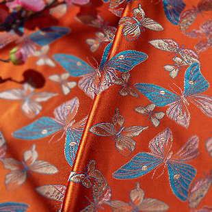橘色l绿色缎面飞舞小蝴蝶秀气花枝织锦缎布料 古香丝绸面料