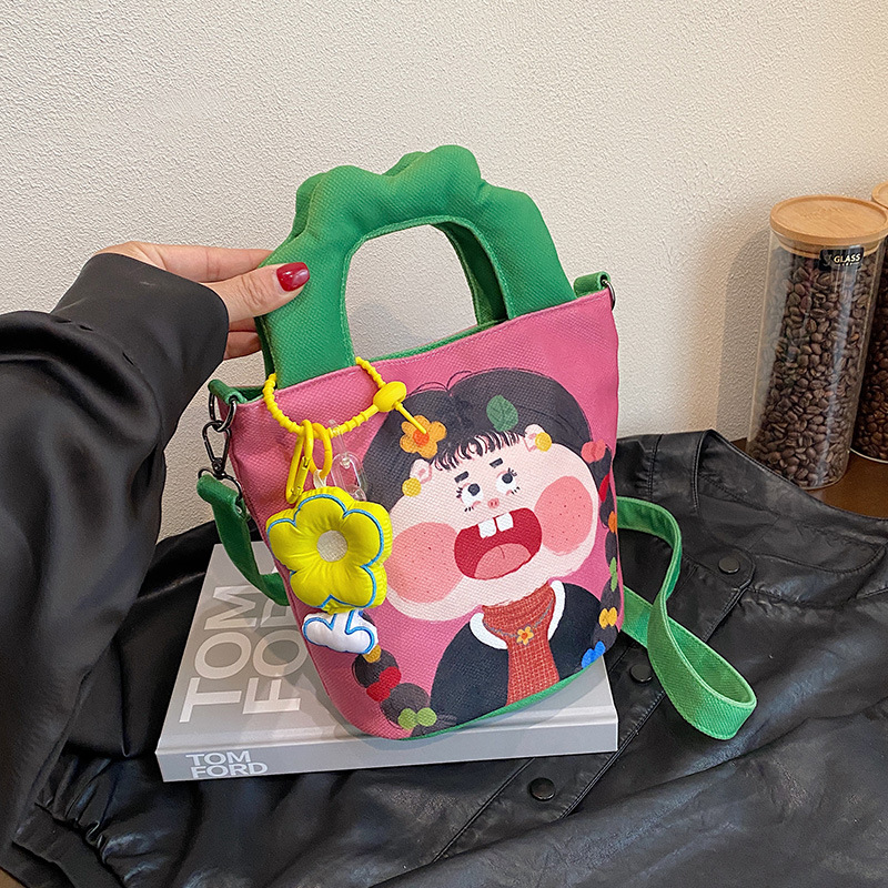 插画设计水桶包包女2025新款潮丑萌帆布手提包搞怪可爱单肩斜挎包