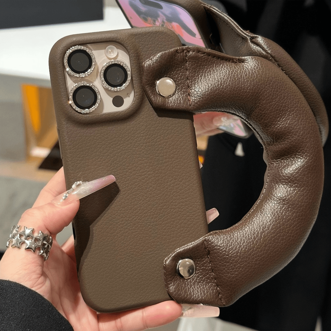 秋冬皮纹手腕带适用苹果17promax手机壳新款iPhone16pro创意15华为p70保护套13小米14皮纹vivo荣耀oppo时尚12