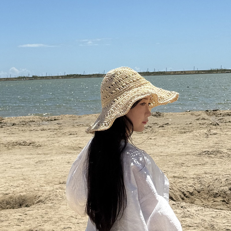 2025新款米色百搭度假风沙滩镂空帽子出游拍照凹造型渔夫帽女草帽