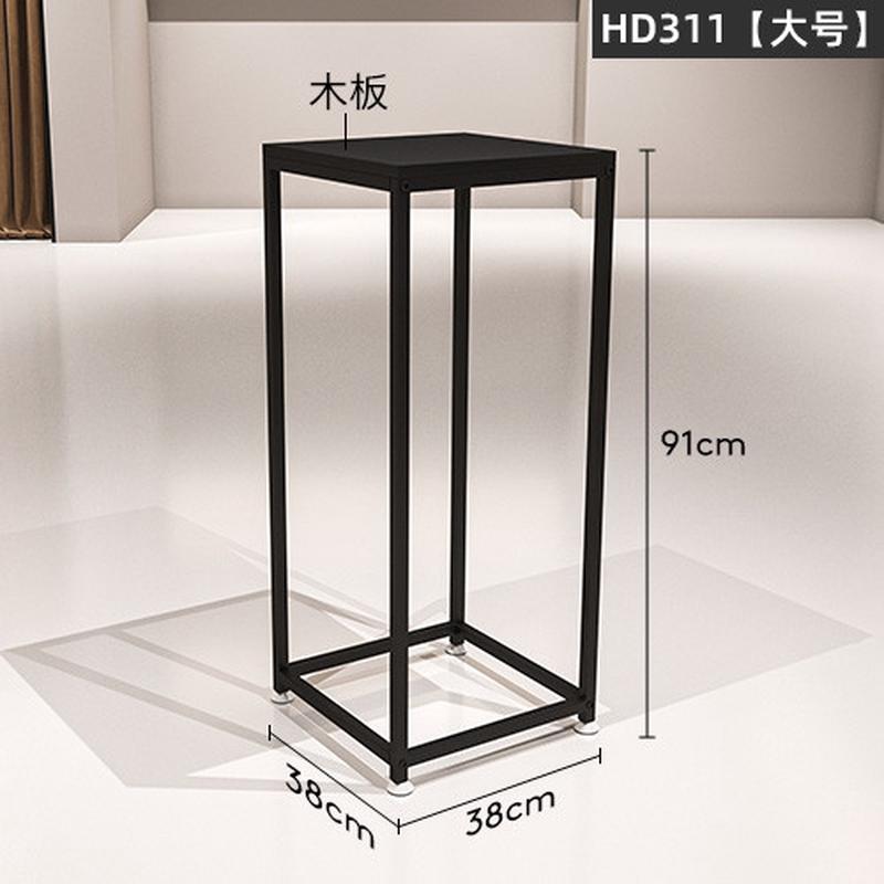 服装店弧形中岛货架中间摆放铁艺黑色陈列架组合店女装衣服展示架