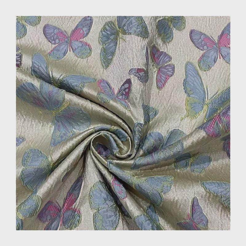 蓝时装蝴蝶撞色立体浮雕括布提花织锦布料蓬蓬裙粉箱包面料