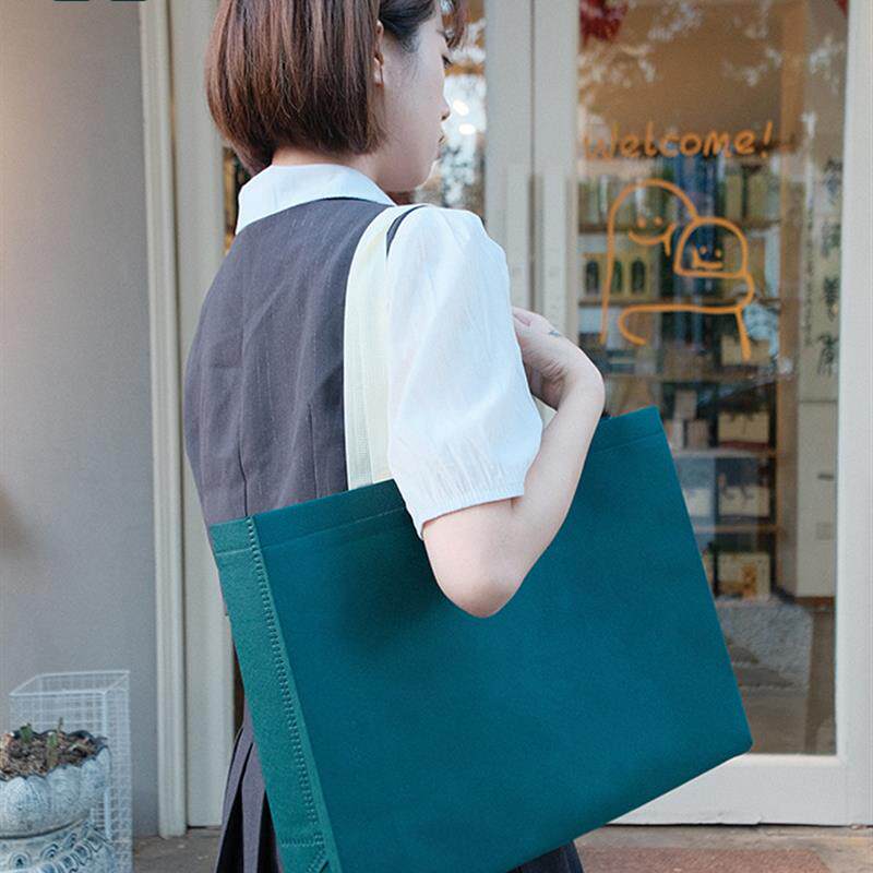 无纺布手提袋服装店用不织布覆膜环保袋纽扣款购物袋防水袋子订做