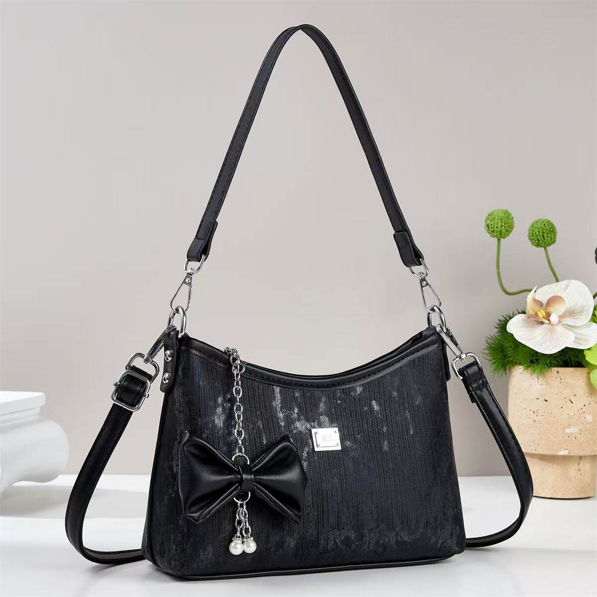 香港真皮包包黑色蝴蝶结腋下包女链条斜挎包百搭通勤手提包
