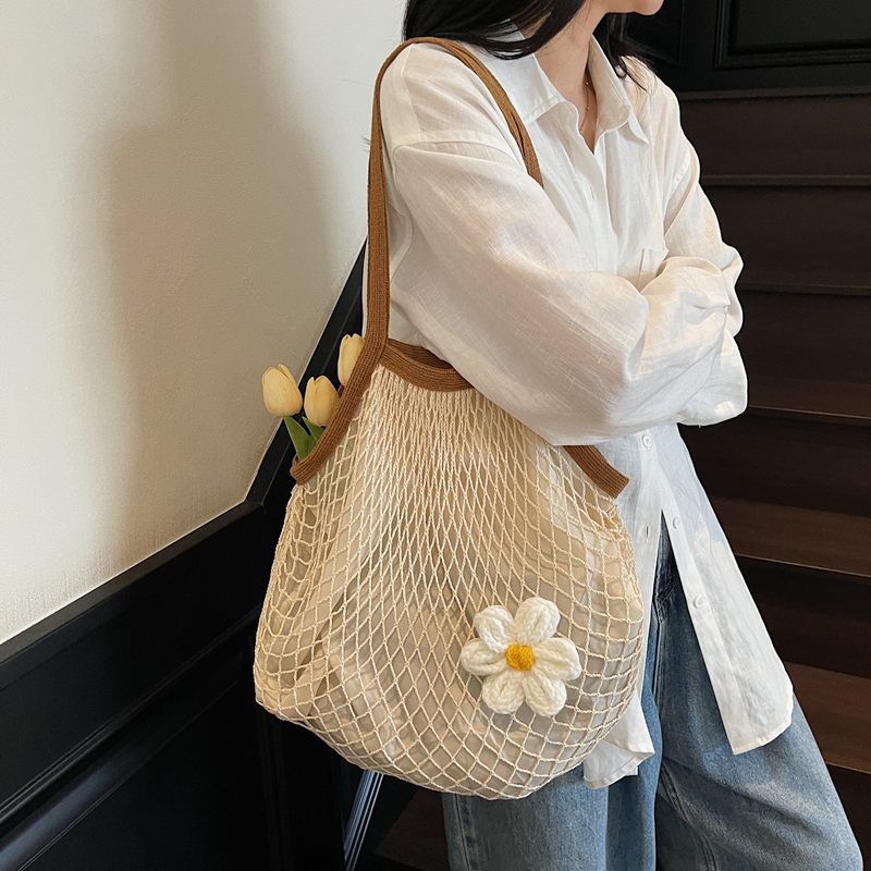 松弛感网兜编织包女大容量2025新款休闲海边度假风夏天草编沙滩包