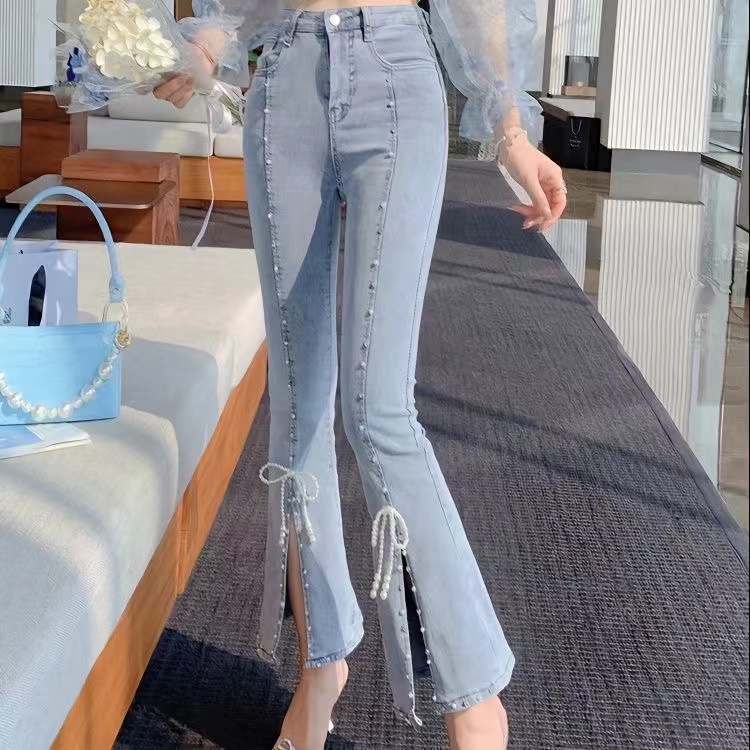 韩版高腰弹力开叉牛仔裤女秋季新款修身显瘦时尚个性钉珠喇叭裤子
