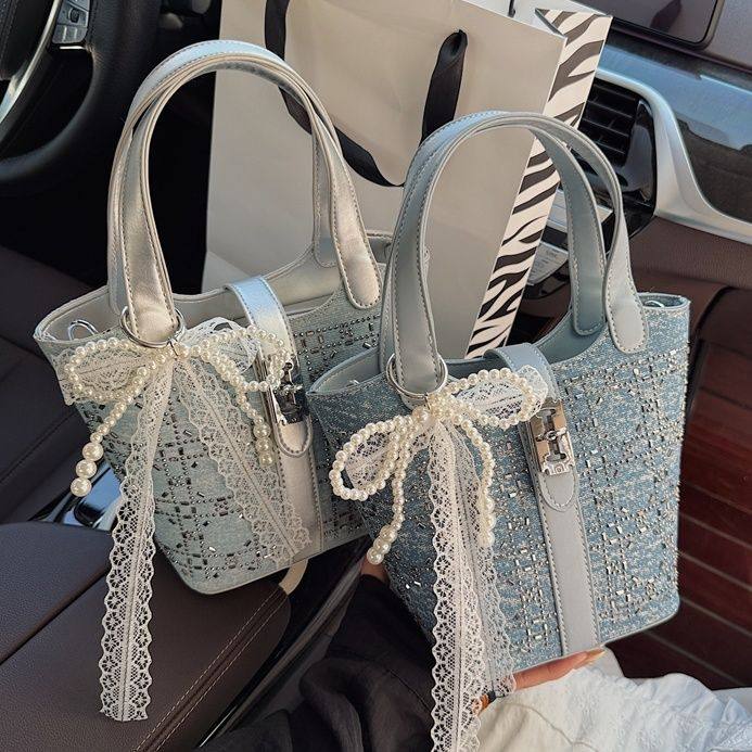 洋气女士水桶包2025新款超火时尚百搭手拎包高级感大容量斜挎包女,箱包皮具/热销女包/男包,小方包,淘宝优惠券,粉丝福利购,淘宝优惠卷