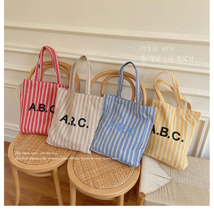 ins同款 APC字母简约通勤单肩帆布包日常搭配购物袋竖条纹手拎布袋