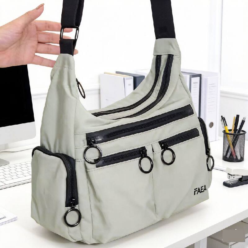 2026双层多拉链袋防泼水尼龙布纯色男女单肩斜挎11寸平板伞杂志包