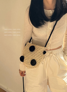 cosy zing 包包夏季2025新款小清新度假毛球圆桶纸绳斜跨草编织包