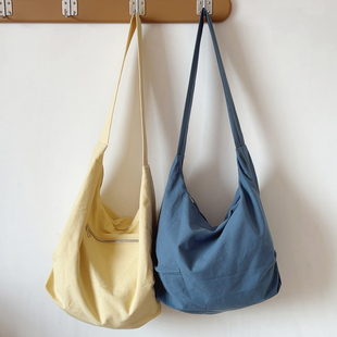 日系ins简约百搭饺子包慵懒风帆布包托特包单肩斜挎包通勤包2025