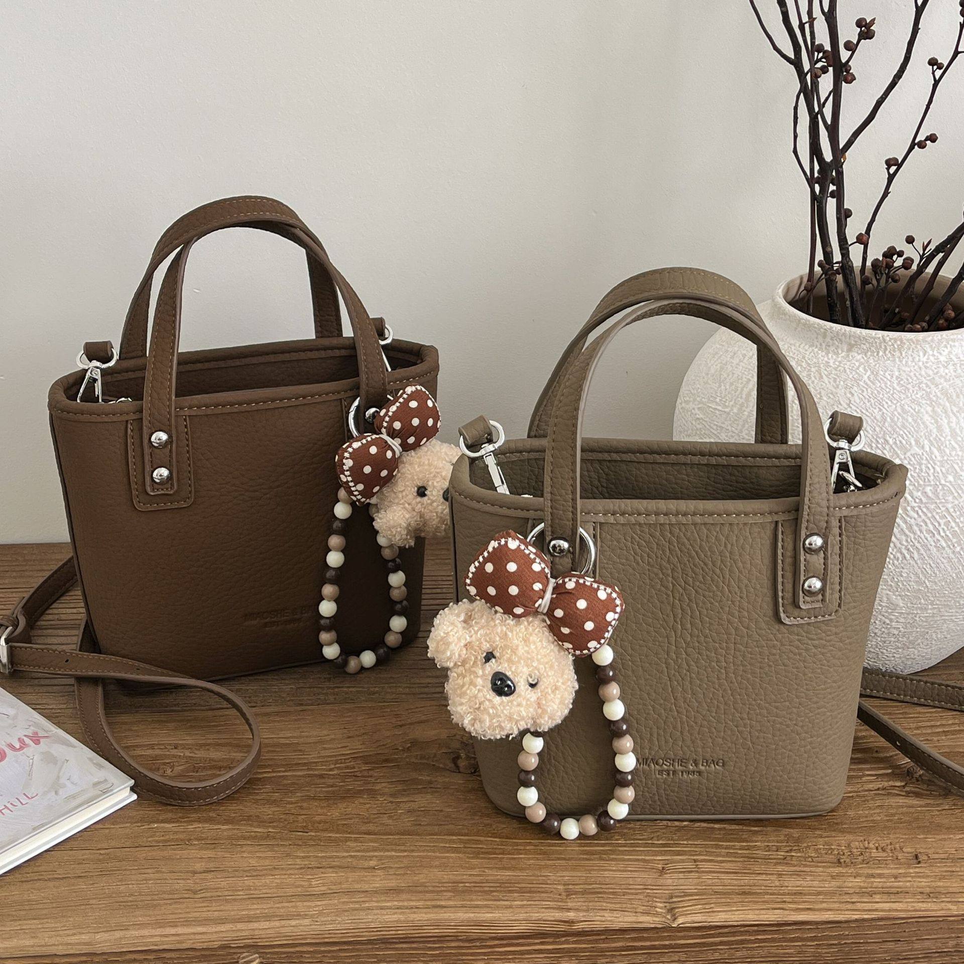 韩版复古质感手提水桶包包女士2026新款春夏高级百搭斜挎包小拎包,箱包皮具/热销女包/男包,单肩包,淘宝优惠券,粉丝福利购,淘宝优惠卷