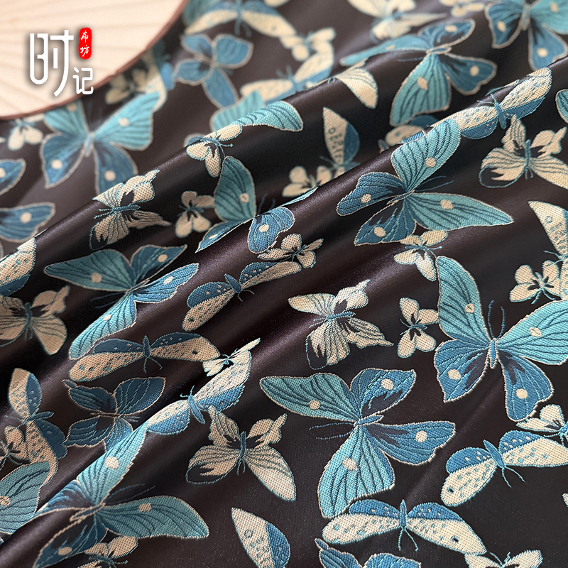 黑底蓝蝴蝶飞舞织锦缎布料