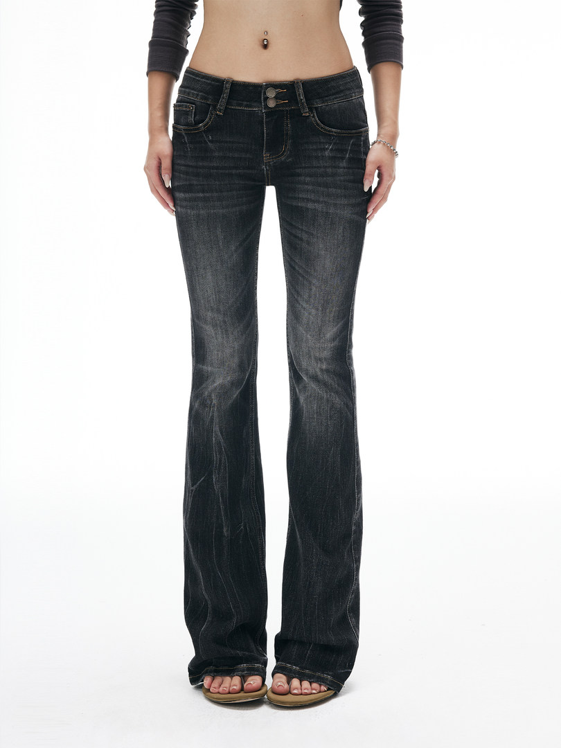 Dark wash flared jeans worn on a model