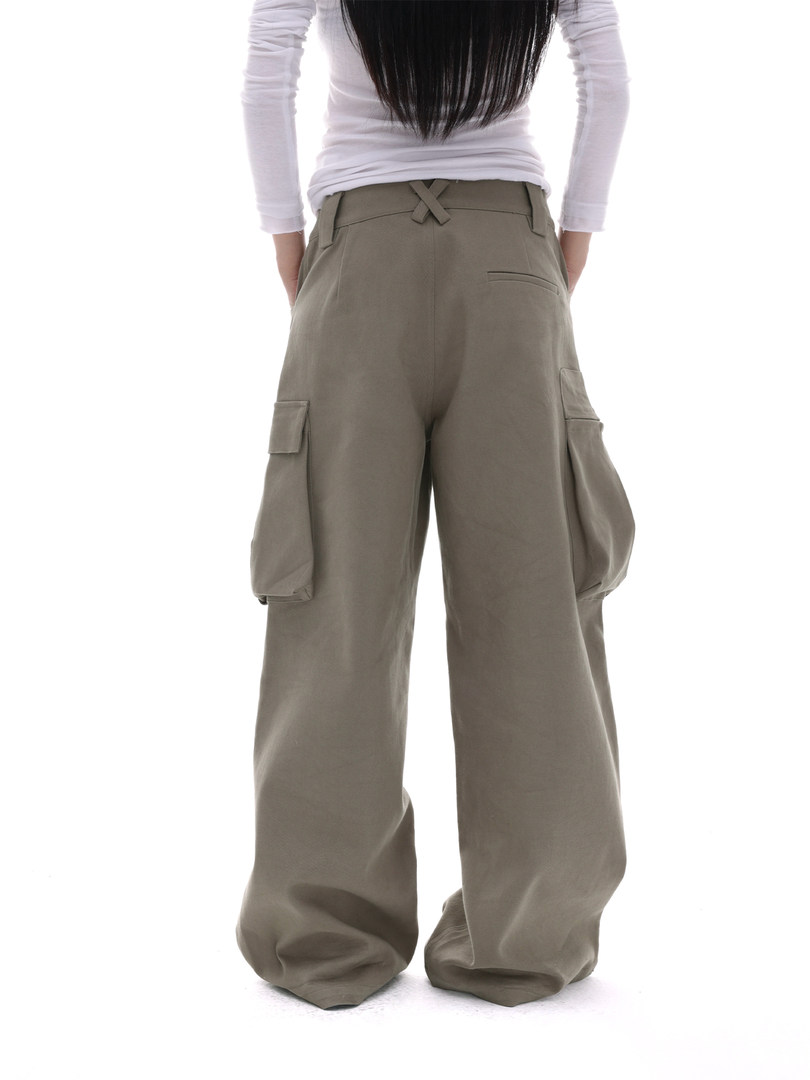 Model wearing wide-leg cargo pants in a neutral khaki color