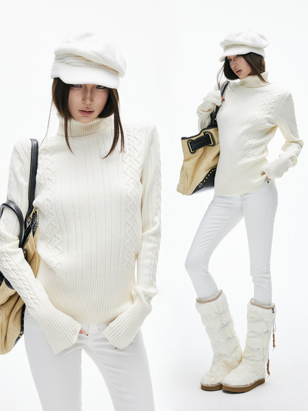 Model wearing a white cable-knit turtleneck sweater with white pants and winter accessories