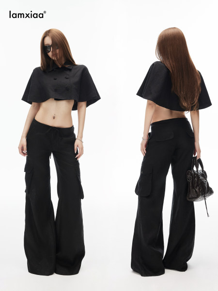 Model wearing a black crop top and wide-leg cargo pants
