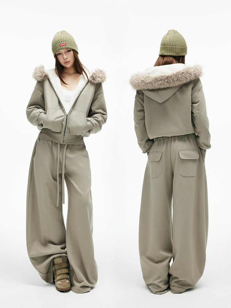 Woman wearing a khaki winter streetwear outfit with fur-trimmed hooded jacket, wide-leg pants, and beanie