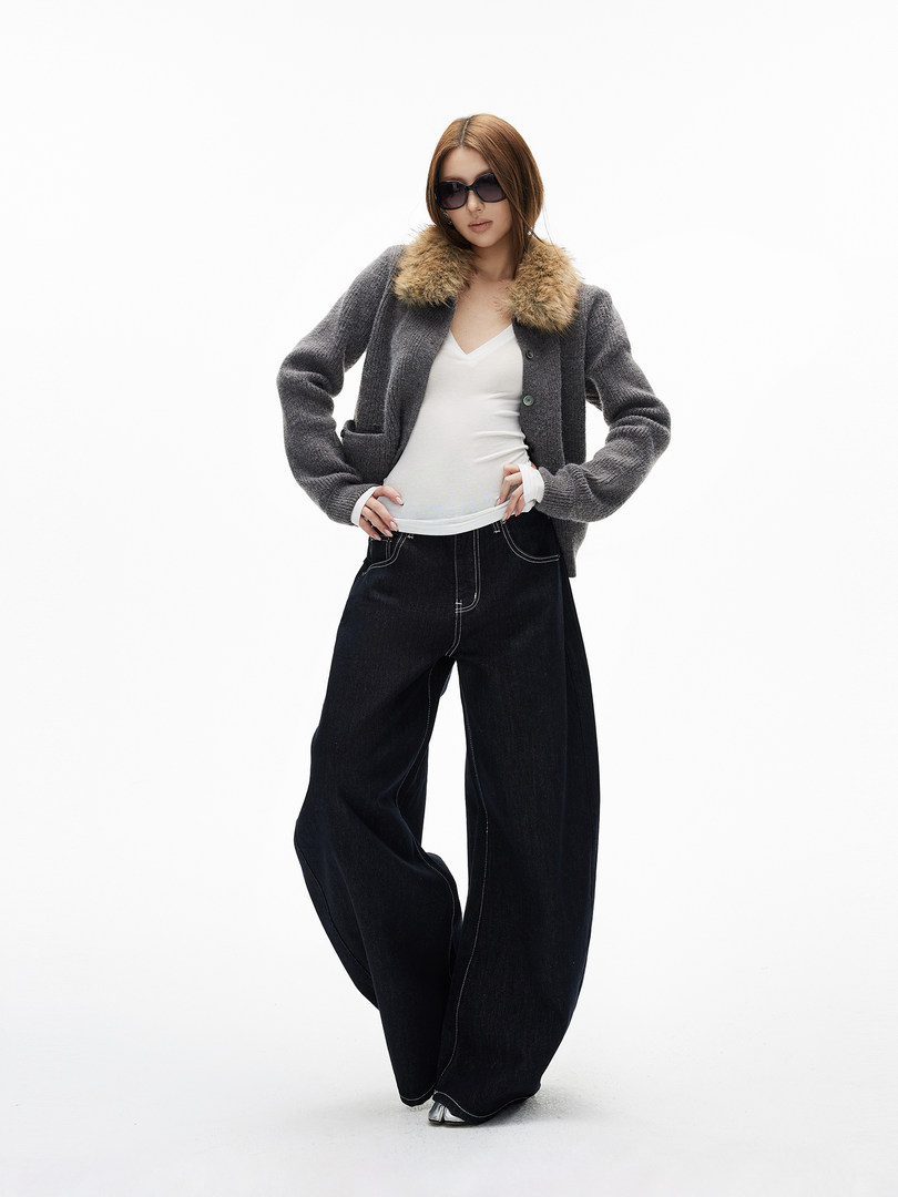 Fashion model wearing a gray fur-collar cardigan with black wide-leg pants
