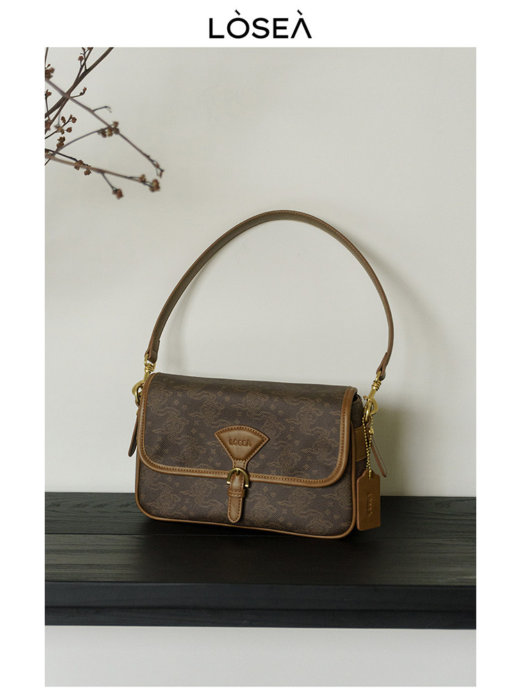 Brown monogram shoulder handbag with tan trim and top handle