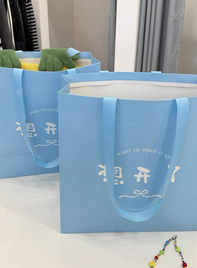 工厂订制服装店粘绳手提袋购物纸袋定制白卡包装纸袋