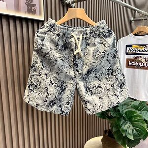 1506/Q001/P39夏季花卉牛仔短裤男时尚百搭宽松青花瓷五分裤图片