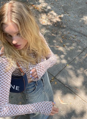 Source unknown elsa同款牛奶巧克力格子镂空斜扣不规则上衣