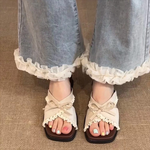 甜美花边蝴蝶结方头平底凉拖鞋女外穿06夏季新款沙滩露趾一字拖