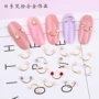 Nail Art Hot Sale Trang sức Net Red Rivet Studded Pearl Smiley Hình bán nguyệt uốn cong Stick Nail Ba Lan Kim cương trang sức - Sơn móng tay / Móng tay và móng chân màu sơn móng tay đẹp 2021