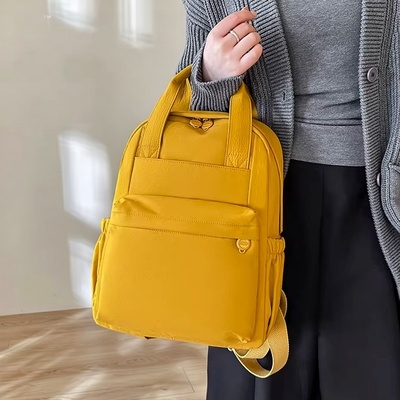 日系纯色手提款两用双肩包