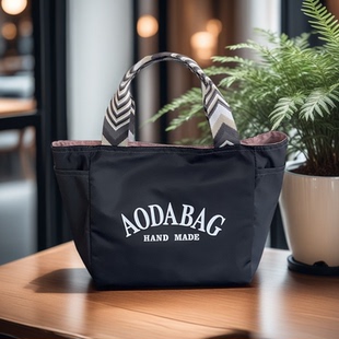 时尚手提包女士简约上班通勤包饭盒袋子便当包水杯雨伞收纳妈咪包