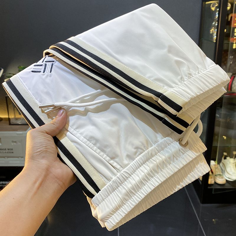 夏季超薄柔软冰丝莫代尔潮流撞色休闲裤男士运动束脚修身九分裤子