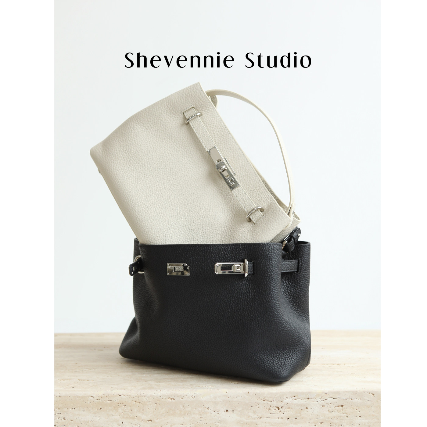 雪芸妮头层牛皮大容量通勤凯莉包