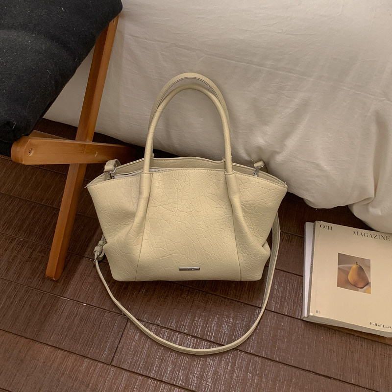 轻奢复古美拉德包包女2026新款超火小众手提翅膀包百搭单肩斜挎包