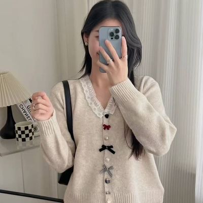 韩冬季气质V领显瘦蕾丝拼接别致蝴蝶结纽扣全羊毛女针织开衫53070