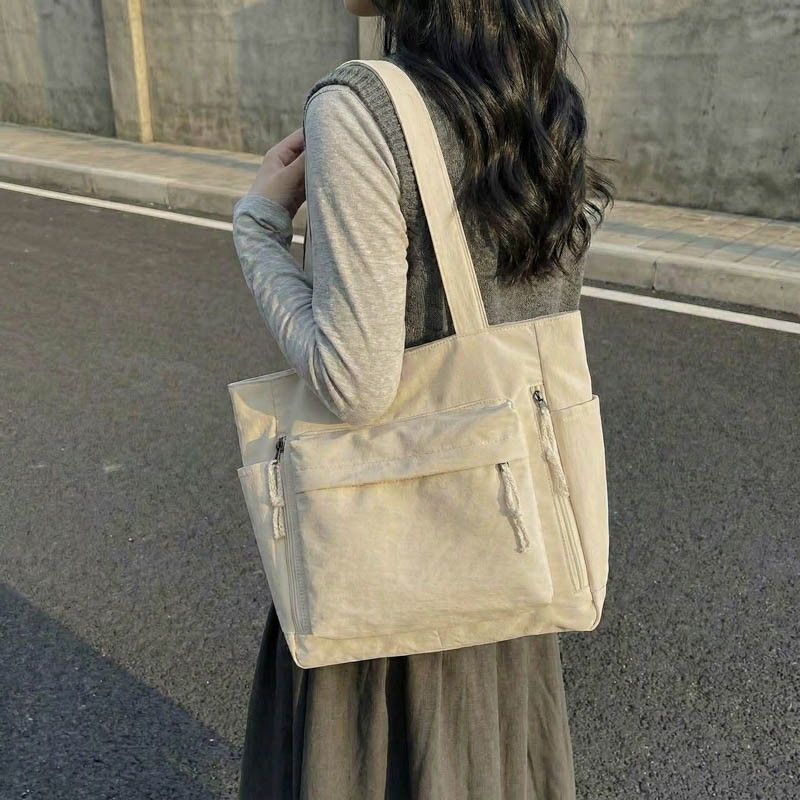 简约帆布包托特包女大容量多口袋休闲通勤百搭手提单肩包2026新款