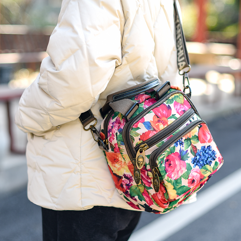 阎双创造多隔层手提包小斜挎包