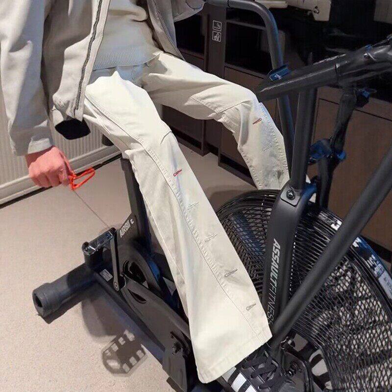 米白色纯棉斜切牛仔裤男款设计感扣眼刺绣裤子cleanfit工装微喇裤