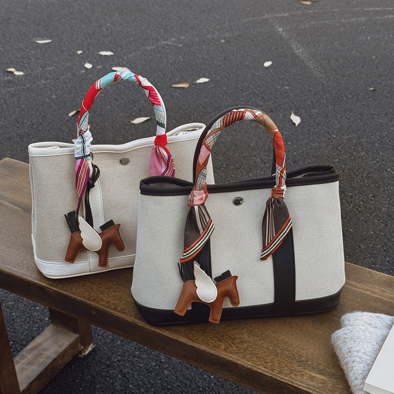 帆布拼皮花园包手提托特包女2026新款高级感大容量通勤单肩斜挎包