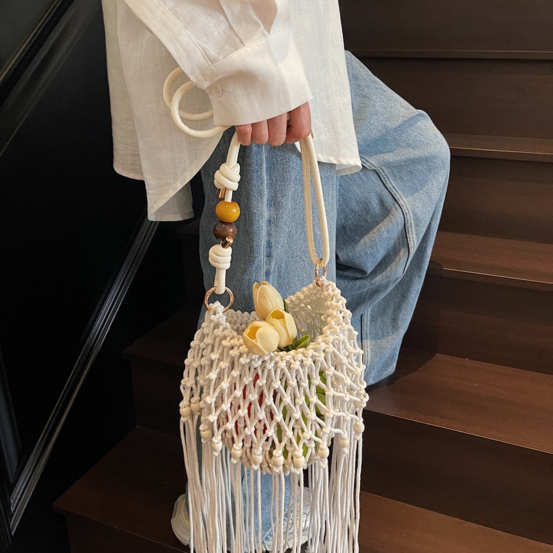 长流苏编织包手工包草编24新款高级斜挎单肩小众设计松弛感