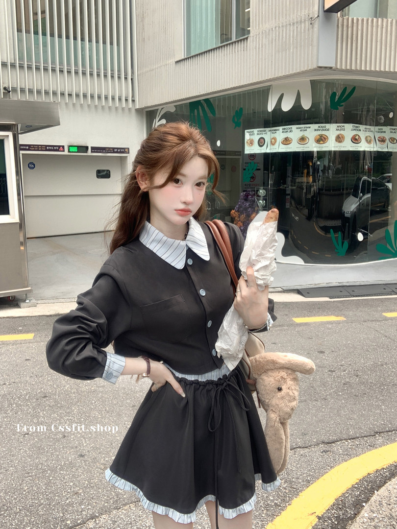 Young woman wearing a black and white preppy outfit outdoors