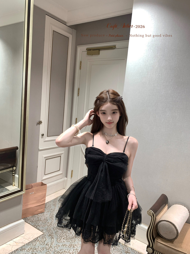 Black strapless tulle dress worn by a model indoors