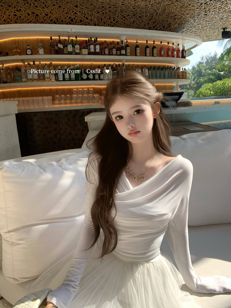 Woman wearing a white long-sleeve formal dress
